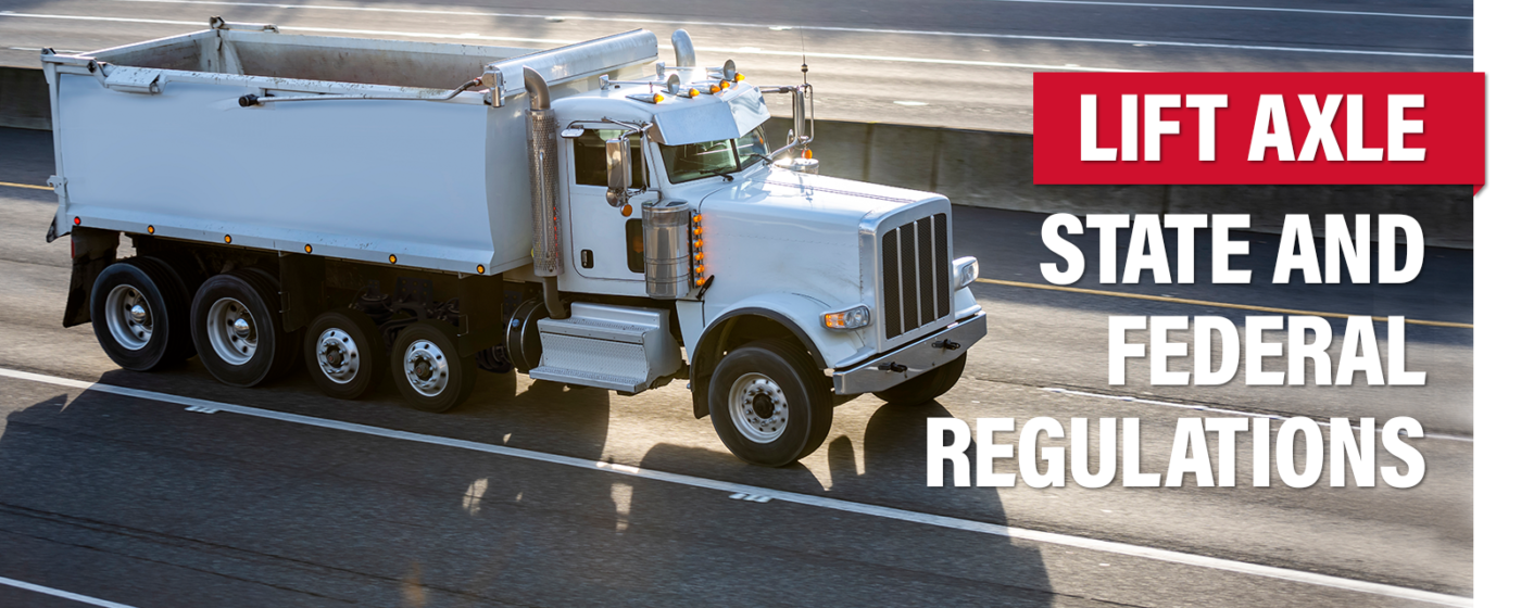 Dump Truck on highway with "Lift Axle - State and Federal Regulations"