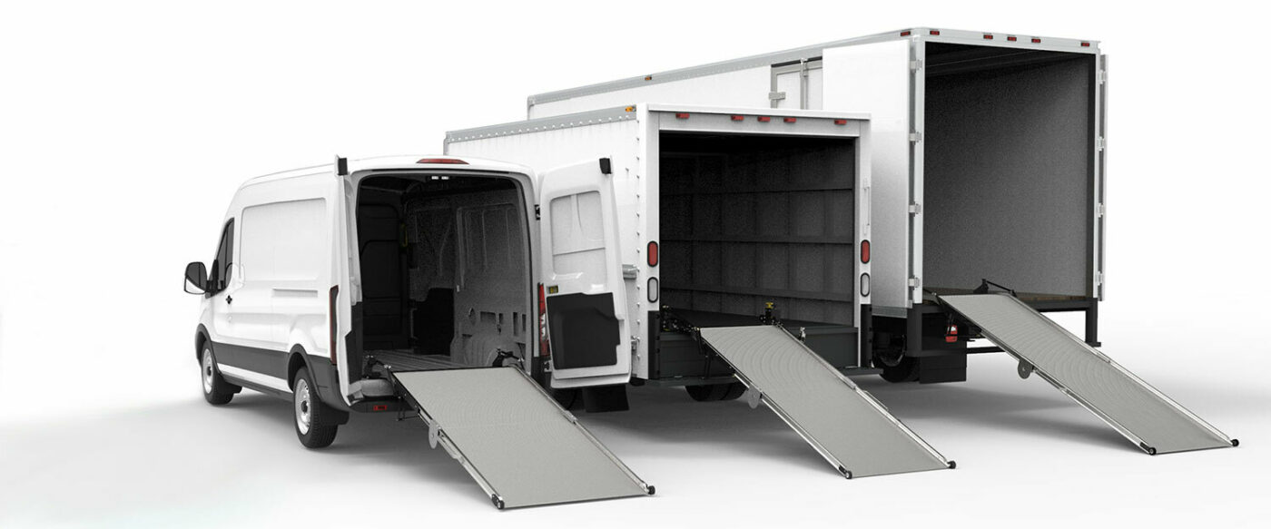 Three cargo vehicles with ramps deployed