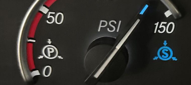 Air compressor dial near 150 PSI.