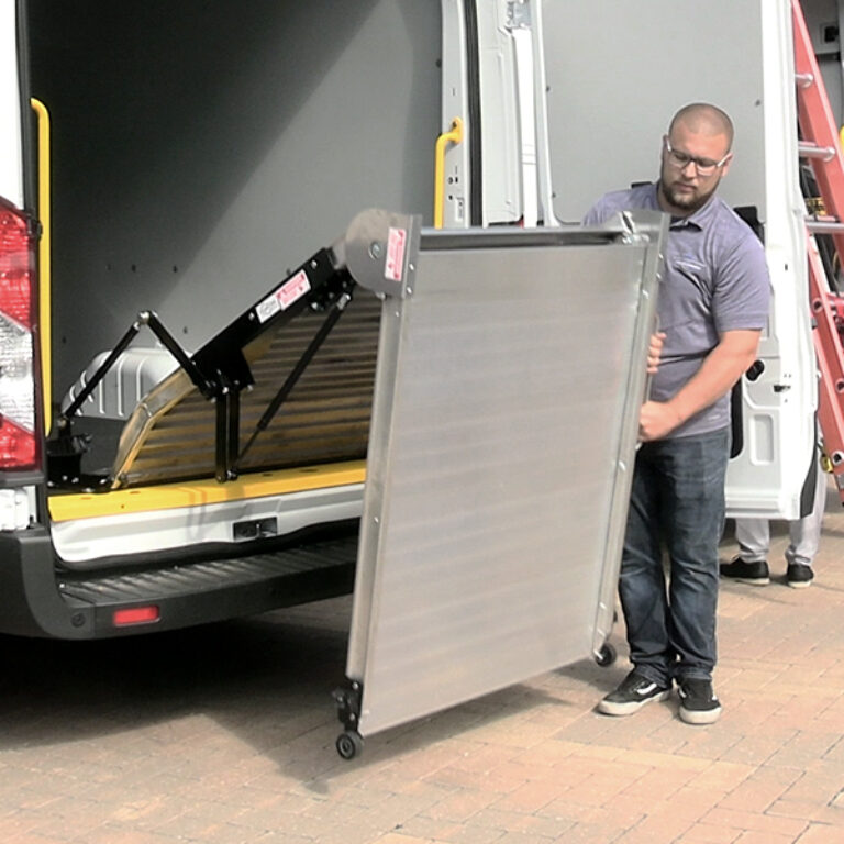 Man unfolding LB20 bifold ramp