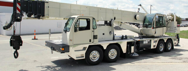 White crane truck in a parking lot