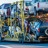 A semi truck hauling passenger vehicles