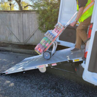 Man dollying drinks down extended LSR90 swivel ramp