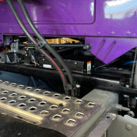 A ROI Cabmate installed on a purple Volvo semi truck.