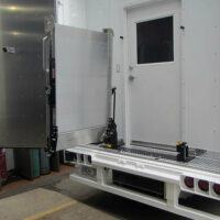 A Link swivel ramp folded outwards at 90 degrees on the back of a vehicle