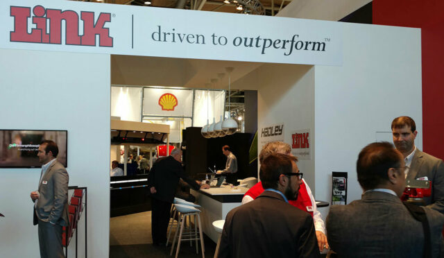 Archway with Link banner along with Link sales representatives at 2016 Commercial Vehicles Show