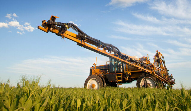 A field sprayer in a fam field equipped with a cab suspension