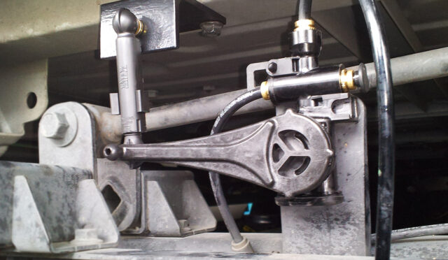 A mechanical height control valve installed on a semi