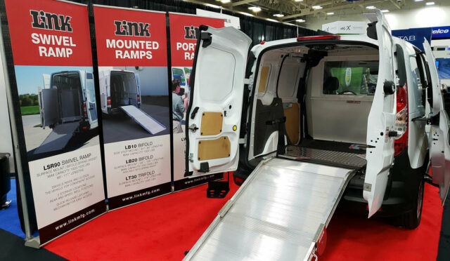 Nafa 2019 booth with a cargo van featuring a Link Mounted Ramp