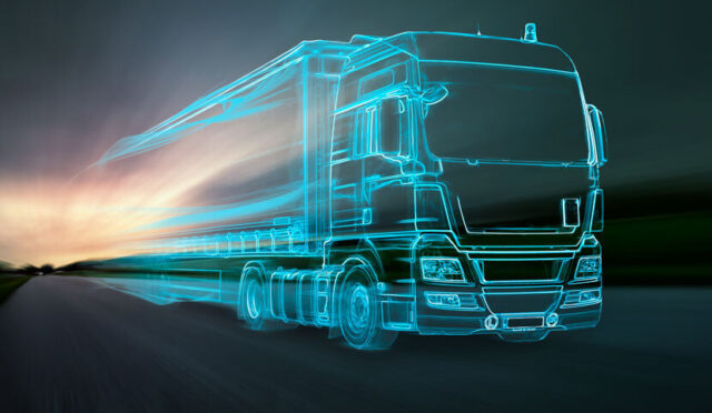 The outline of a truck moving in a blurred photo