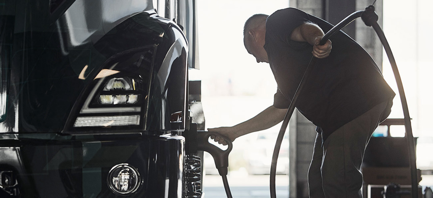 Man charging EV truck
