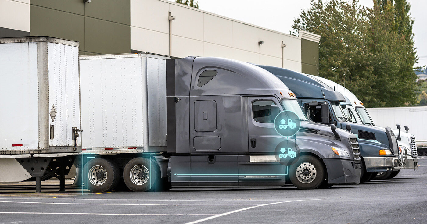 Trucks coupling to trailers at loading dock with SmartValve up and down arrows.