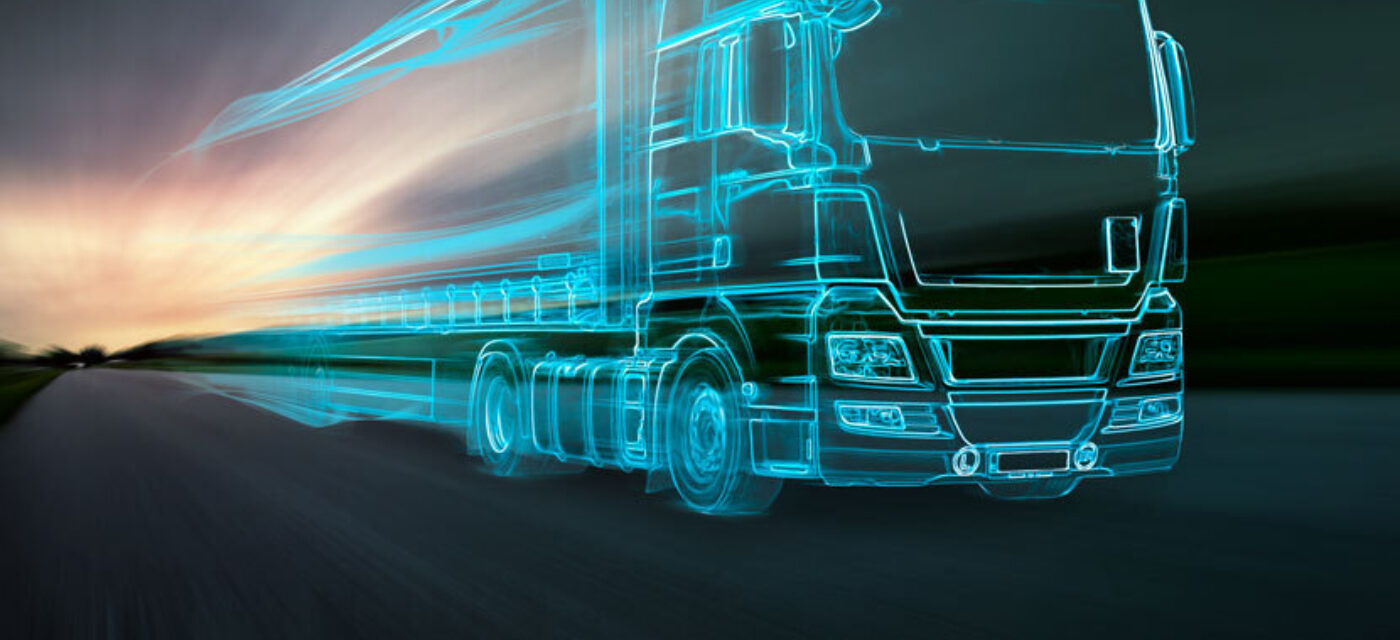 The outline of a truck moving in a blurred photo