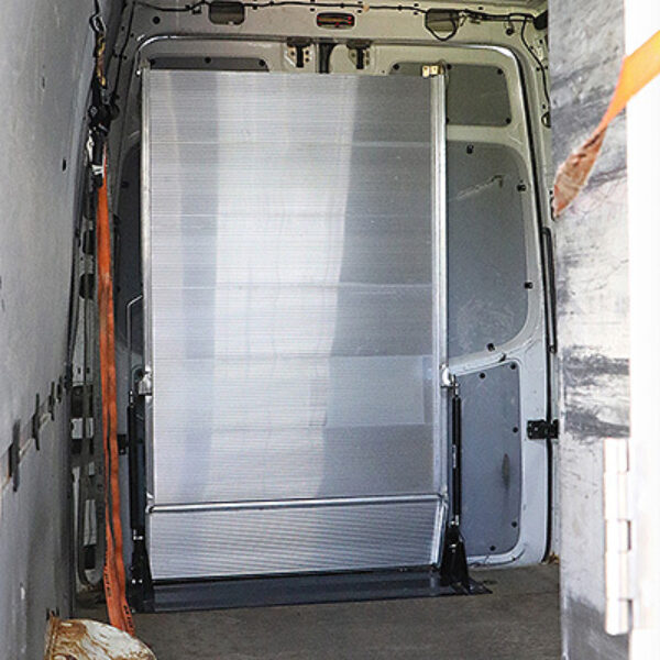 LB20 ramp folded inside a cargo van with rear doors closed