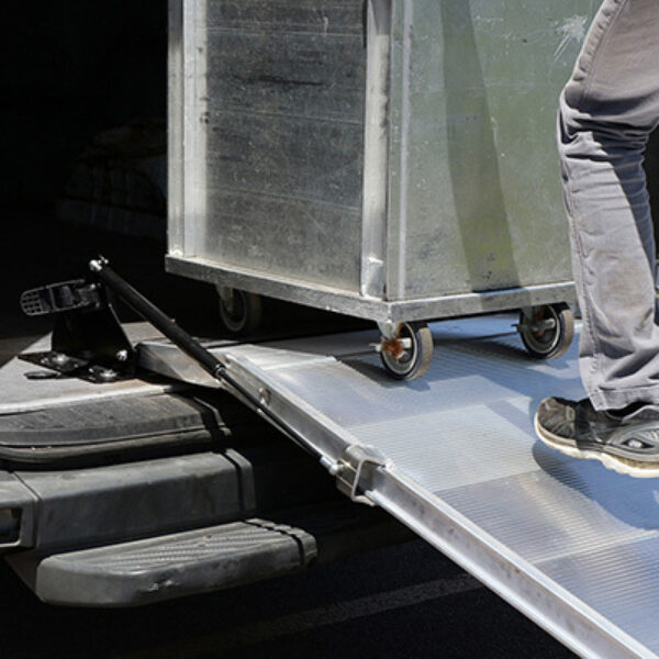 Refrigerated cart rolling over the LB20's low-profile threshold into cargo van