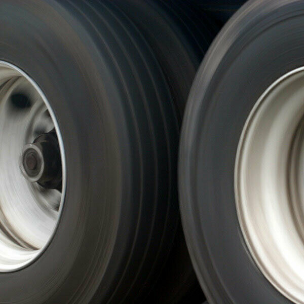 Two tires on a semi truck in motion