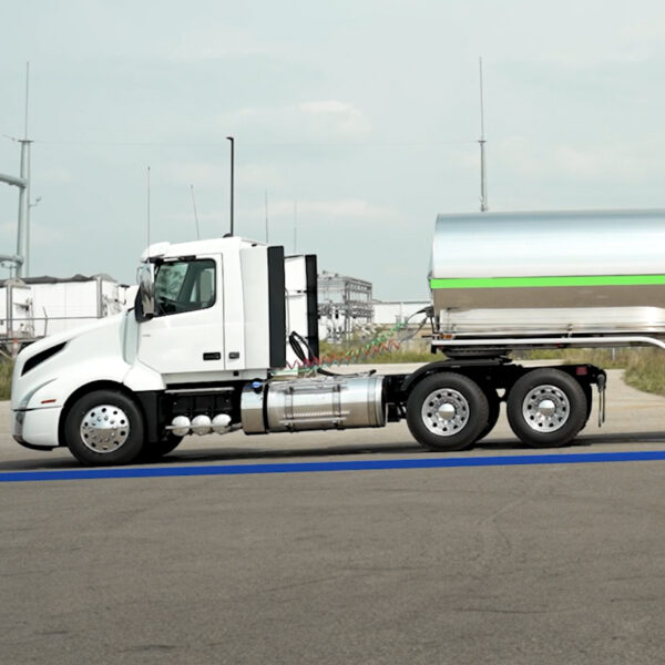 A tanker trailer lifted above ride-height for maximum product discharge.