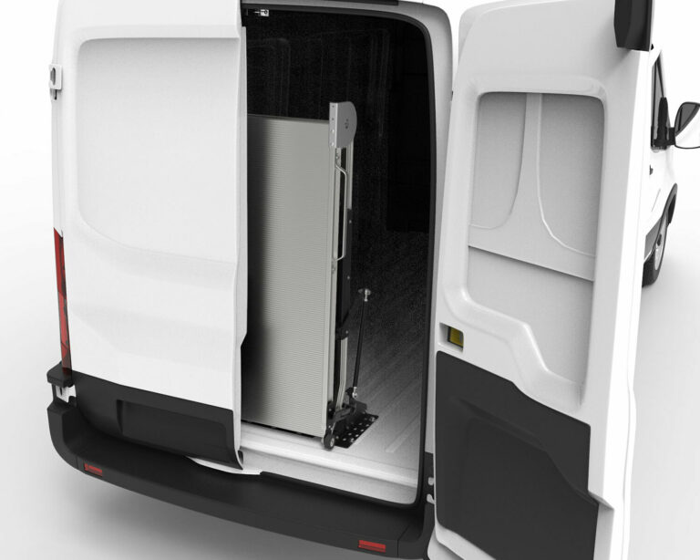 LB20 42” x 108” aluminum bifold mounted ramp folded in upright position inside cargo van partially concealed by back door