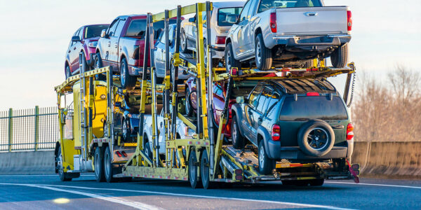 A semi truck hauling passenger vehicles