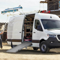 A Link Side Door Ramp extending out of a Mercedes Benz Sprinter Cargo Van.