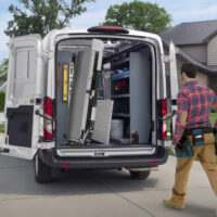 A Link Swivel Ramp swiveled 90 degrees outside of a Ford Transit Cargo Van.