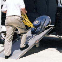 Man loading equipment using LB10 side door ramp