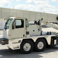 White crane truck in a parking lot