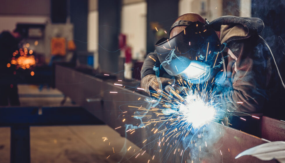Man welding on frame rail